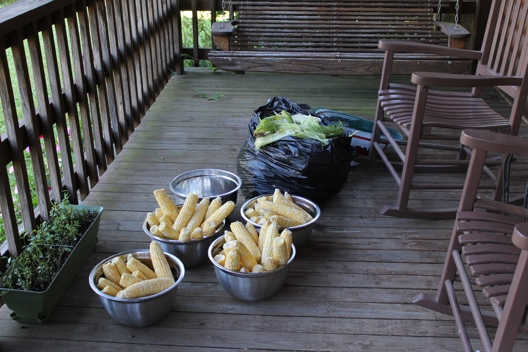 A beautiful cool summer morning to shuck the corn on the front porch.