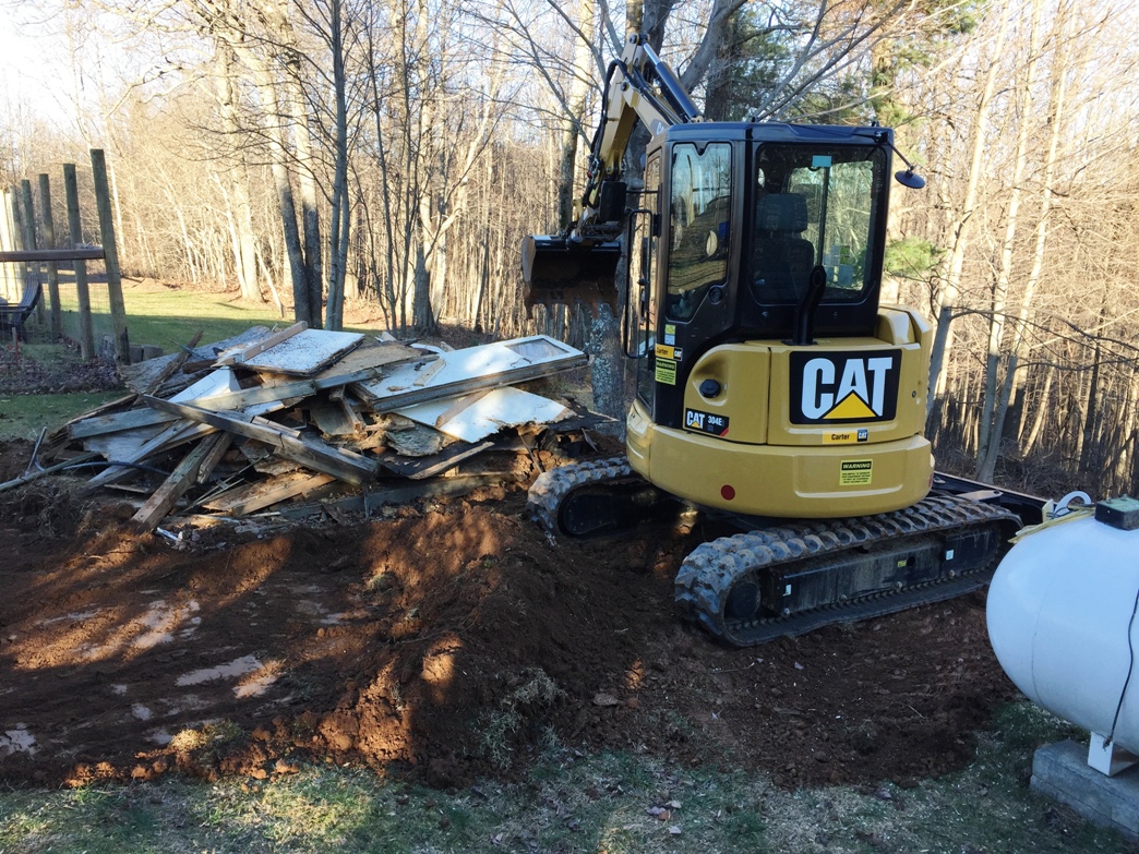 The Tonka Truck in the footprint of the shed formerly known as the Chicken Coop.